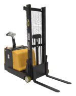 The Vestil Counter Balanced Powered Lift 2 To 62 In, a yellow and black electric pallet stacker, has vertical forks, a control handle, and small wheels. It features safety instructions and branding labels on the frame and is ideal for lifting pallets effortlessly from 2 to 62 inches.