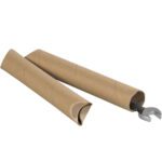 Two 1 1/2 x 9 Kraft Crimped End Mailing Tubes are expertly crafted and shown on a pristine white background, one open with a metallic wrench partially sticking out diagonally, highlighting their sturdy design.
