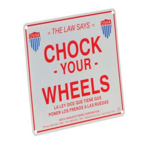 The square safety sign displays The Law Says Chock Your Wheels in English and Spanish with OSHA logos, featuring the Vestil Aluminum Enamel Wheel Chock Sign 9.75 In, and includes Vestil Manufacturing Corporations contact details at the bottom.