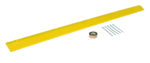 A long yellow plastic Vestil Speed Bump-Asphalt Hardware measuring 106 X 10 X 2 is shown on a plain white background, accompanied by a roll of brown tape and five sturdy metal bolts for secure installation.