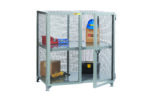 The Little Giant Visible Contents Welded Storage Locker with metal mesh design holds various items on two shelves, including a blue hard hat, cardboard boxes, a red cup, and a black toolbox. Its dual doors provide easy access, with one door conveniently left open.