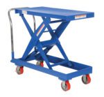 The Vestil Steel Auto-Hite Cart W/ 500 Lb 20.3X40.3 has a blue hydraulic scissor lift table, a handle, and four red caster wheels. Its tabletop dimensions are 20.3x40.3 inches, supporting up to 500 lbs with visible lift mechanism and safety warning labels on the sides.