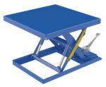 The blue Vestil Scissor Lift Table 42X42 with a yellow handle features a sturdy metal frame, two sets of scissor arms, and a foot pedal. Its designed for elevating or lowering loads up to 2000 pounds using the foot pump.