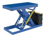 The Vestil Scissor Lift Table 20X40 2500 Capacity Ac features a blue hydraulic platform, pistons, a yellow support bar, and black motor housing on its sturdy metal frame for efficient performance.