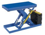 The Vestil Scissor Lift Table 20X40 2500 Lb 12Dc, in blue and yellow, features hydraulic cylinders on a metal frame with a rectangular platform for lifting. A black control box with a red button is conveniently attached to the side.