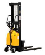 The Vestil Hand Pump/DC Stacker 118 In Fix Fork/Leg sports a yellow and black design with a steering handle, fixed fork legs, warning labels, and a vertical lifting mechanism for easy pallet movement in warehouses. Wheels offer smooth maneuverability for enhanced efficiency.
