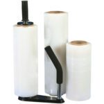 Displayed are three rolls of MH-USA 12 x 70 Gauge x 1500 Blown Hand Stretch Wrap (4/Case): two upright with visible brown cores, and one on a black handle for easy application, ideal for wrapping and securing items efficiently.
