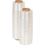 Two rolls of MH-USA Pre-Stretch Wrap (14.5 x 38 Gauge x 1500, 1 Pack) with brown cardboard cores stand upright, perfect for efficient packaging and securing items.