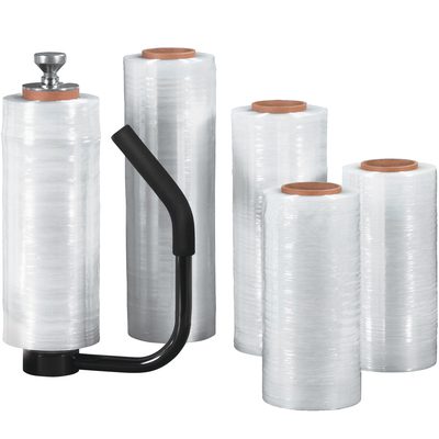 SF188CAST.jpg Four rolls of MH-USA 18 x 80 Gauge x 1500 Cast Hand Stretch Wrap are displayed with a black handheld dispenser. They are positioned vertically, showcasing their cylindrical shape and clear material, perfect for packaging or wrapping.