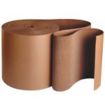The 36 x 250 B Flute Kraft Singleface Corrugated Roll (250/Roll) is partially unrolled, displaying its wavy texture. Standing upright against a plain white background, its perfect for fulfilling your packaging needs.