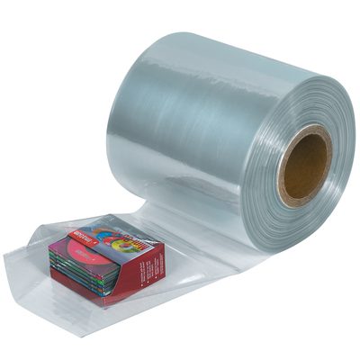 SHT6100.jpg Partially unrolled MH-USA 6 x 100 Gauge x 1500 Shrink Tubing (1500/Roll) reveals clear plastic film, displaying a small stack of colorful books or boxes, with a sturdy cardboard core at the center.
