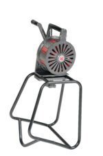The Vestil Siren - Hand Crank - Floor Stand is an industrial-style manual device with a circular, grill-like casing featuring red accents. It operates via a hand crank, mounted on a sturdy floor stand for emitting loud warning signals effectively.