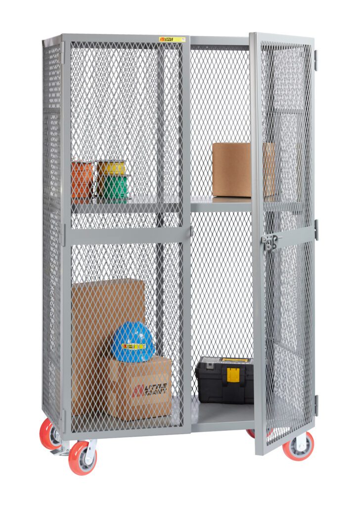 A gray Little Giant All-Welded Mobile Storage Locker with mesh doors is partially open, showing boxes and containers on the shelf above a black toolbox and larger cardboard boxes. Stylish red wheels add color.