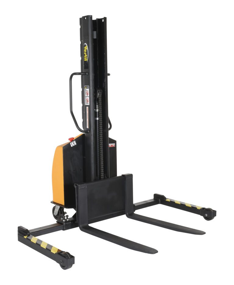 The Vestil Stacker Narrow Mast Adj Forks 63 In 1.5K, in orange and black, features adjustable forks extending to 63 inches, a vertical mast, and mobility wheels. It safely handles loads up to 1.5K pounds with clearly marked tines laid on the floor.