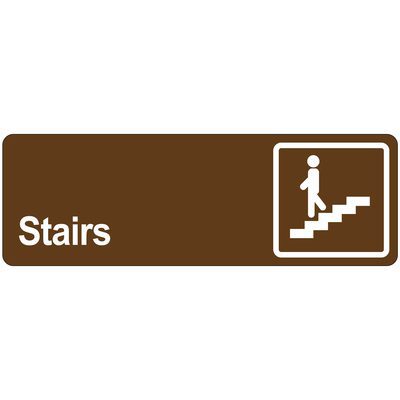 SN514.jpg A brown MH-USA Door Sign - Stairs shows a white icon of a person on stairs inside a right-side square, with Stairs printed to the left.