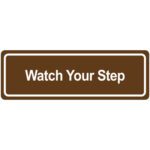 The MH-USA Door Sign is brown and rectangular with a white border, displaying the phrase Watch Your Step in bold, capitalized white letters.