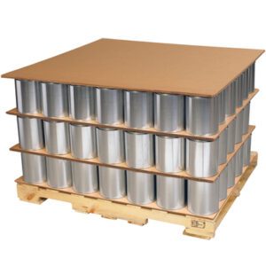 A pallet holds large empty metal cans in three grid-pattern layers, separated by MH-USA 40 x 48 Triple Wall Corrugated Sheets (5/Bundle), and sits securely on a wooden base.
