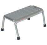 The Vestil Aluminum Step Stand - 1 Step - Welded is a rectangular metal stool with a serrated, non-slip surface. It has four sturdy legs with black rubber feet for stability on various surfaces and showcases expertly welded construction.
