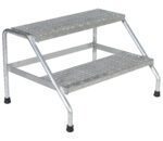 The Vestil Aluminum Step Stand - 2 Step Wide Welded ensures safety with its simple frame, rubber-tipped legs, and textured, slip-resistant steps for secure climbing.