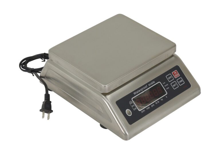 The Vestil Stainless Steel Parts Scale 66 Lb Cap features a sleek surface, black display, and buttons for power, tare, and units. With a two-prong power cord and screen showing zeroes when ready, it ensures precise measurements.