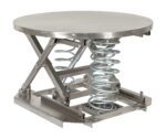 The Vestil Spring Scissor Table Part Ss Solid 4,500 is a round, industrial metal table with a smooth top and exposed coiled springs underneath, featuring robust metal supports and mechanical appeal perfect for any workshop.