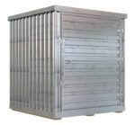 Crafted from durable materials, the silver-gray Vestil Storage Building with corrugated sides and a closed 6X6 wide door rests on wooden pallets. Accented by rust spots, it combines rugged industrial style with functional appeal.