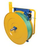A large, yellow hose reel with a green hose is mounted on a blue and yellow frame, resembling the durable design of the Vestil Wall-Mounted Strapping Cart. The neatly coiled hose stands out against a white background.