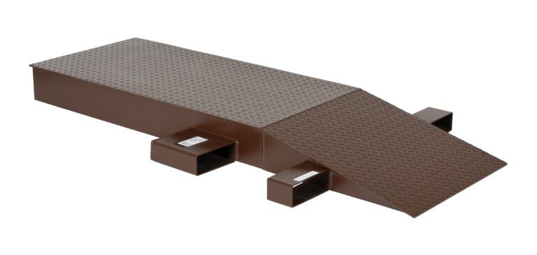 SWR-24-6-72_A.jpg The Vestil Steel Wheel Riser 72L X 24W X 6.25H is a brown metal ramp with a textured surface, featuring a flat rectangular section leading to an inclined slope and hollow rectangular supports underneath for stability.