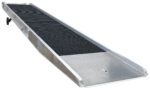 The Vestil Alum Yard Ramp Steel Grating (74 in x 30 ft) showcases a steel grating surface, grated surfaces, and raised edges for wheeled access to elevated areas. It is designed with precision on a white background.