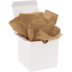 An open small white cardboard box contains crumpled 15 x 20 Kraft Gift Grade Tissue Paper (960 Sheets), adding rustic elegance.