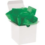 A white gift box is open, with 480 sheets of MH-USA Kelly Green Gift Grade Tissue Paper (20 x 30) spilling out in a bright cascade.