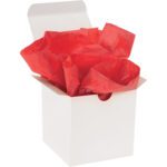A white gift box is elegantly filled with crumpled red tissue paper from the MH-USA 20 x 30 Mandarin Red Gift Grade Tissue Paper (480 Sheets) collection.