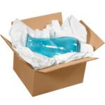 A blue glass vase is nestled inside an open cardboard box, safeguarded by MH-USA 15 x 20 Heavy Tissue Paper (60Lbs / Case) for ultimate protection.