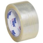 A roll of 2 x 55 yds. Clear Tape Logic® Lbs1000 Economy Tape, with the label visible inside featuring Tape Logic in blue and red, is wound tightly at an angle against a plain background. The roll is part of a case containing 36 rolls.
