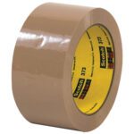 A partially unwound roll of 2 x 55 yds. Tan Scotch® Box Sealing Tape 373 shows its classic yellow core with red and green plaid branding, labeled Scotch 373.