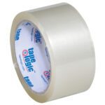 A roll from the Tape Logic® Lbs400 Industrial Tape 6-pack, measuring 2 x 55 yds., is shown on a white background with its clear transparency revealed. The inner label visible is white and blue and displays Tape Logic.