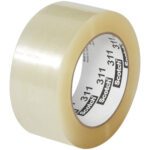 A roll of 2 x 110 yds. Scotch® Box Sealing Tape 311+ (6 Pack) with a tan tint is depicted against a white backdrop. The inner label highlights the brand and number 311 in bold black text, offering strength and reliability for packaging needs.