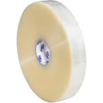 A large roll of 2 x 1000 yds. Clear Tape Logic® Lbs1000 Economy Tape, with a blue and white label, stands upright against a white backdrop. This durable adhesive essential comes in a case of six rolls.