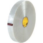 A roll of 2 x 1000 yds. Clear 3M™ 355 Carton Sealing Tape (4/Case) with a yellow core is partially unrolled against a white background, highlighting its transparent quality, ideal for sealing needs.