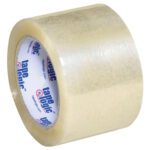 The 3 x 110 yds. Tape Logic® Lbs170 Clear Industrial Tape (6 Pack) features a glossy finish, a white core with blue Tape Logic® text, and is partially unwound, highlighting its reliable strength for packaging needs.