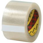 The 3 x 110 yds. Clear Scotch Box Sealing Tape 311+ comes in a 6 Pack, featuring a plaid core and labeled Scotch, ideal for sealing boxes and packages.
