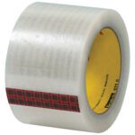 A roll of 3 x 110 yds. Clear Scotch® Box Sealing Tape 371, with a red and black plaid inner design, is wound around a yellow core. Its available in a handy 24-case pack for all packaging needs.