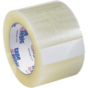 The 3 x 55 yds. Clear Tape Logic® Lbs131 Quiet Carton Sealing Tape has a blue and red logo printed inside the core. The tape, with a glossy, transparent finish, is partially unrolled.