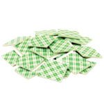 Small 1x1 tiles with a green plaid pattern are scattered against a white background, echoing the precise placement achievable with 1 x 1 3M™ 4026 Double Sided Foam Squares.