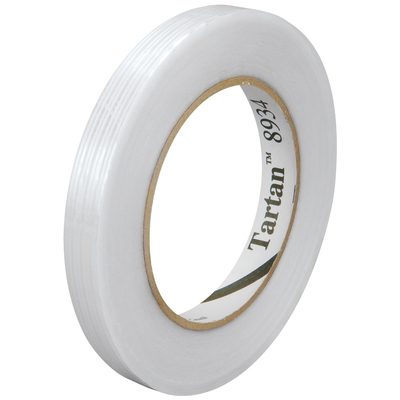 T912893412PK.jpg A roll of 3/8 x 60 yds. Tartan™ Filament Tape 8934 sits at a slight angle, featuring clear, shiny tape wound around a brown cardboard core labeled Tartan 8934, and is packaged conveniently in a case of 12 for all your needs.