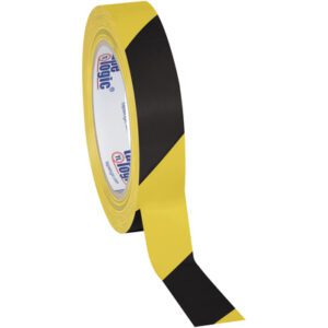 A partially unrolled roll of 1 x 36 yds. Black/Yellow Tape Logic® Striped Vinyl Safety Tape shows black and yellow diagonal stripes, with printed text inside. Sold in cases of 48 rolls, ideal for extensive safety applications.