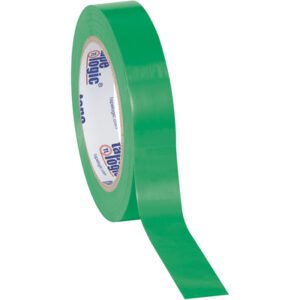 A 1 x 36 yds. Green Tape Logic® Solid Vinyl Safety Tape roll unfurls its glossy green surface, revealing the white core with blue and red text. The roll is angled to show both its side and a glimpse of the adhesive surface.