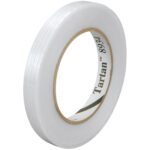 A roll of 1/2 x 60 yds. Tartan™ Filament Tape 8934 (72/Case) sits on your desk with its label visible on the inner cardboard ring. The tape is partially unwound, showing a smooth, shiny surface promising strong adhesion for any project.