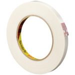 A roll of Scotch® Filament Tape 897, measuring 1/2 x 60 yds., displays a yellow core with the brand name visible. Positioned slightly angled against a white background, it showcases quality and durability similar to its creamy white masking tape counterpart.