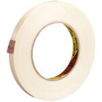 A roll of glossy 1/2 x 60 yds. Scotch® Filament Tape 898 with a cardboard core and checkered red/black label, slightly unwound. Available in a convenient 12 Pack.